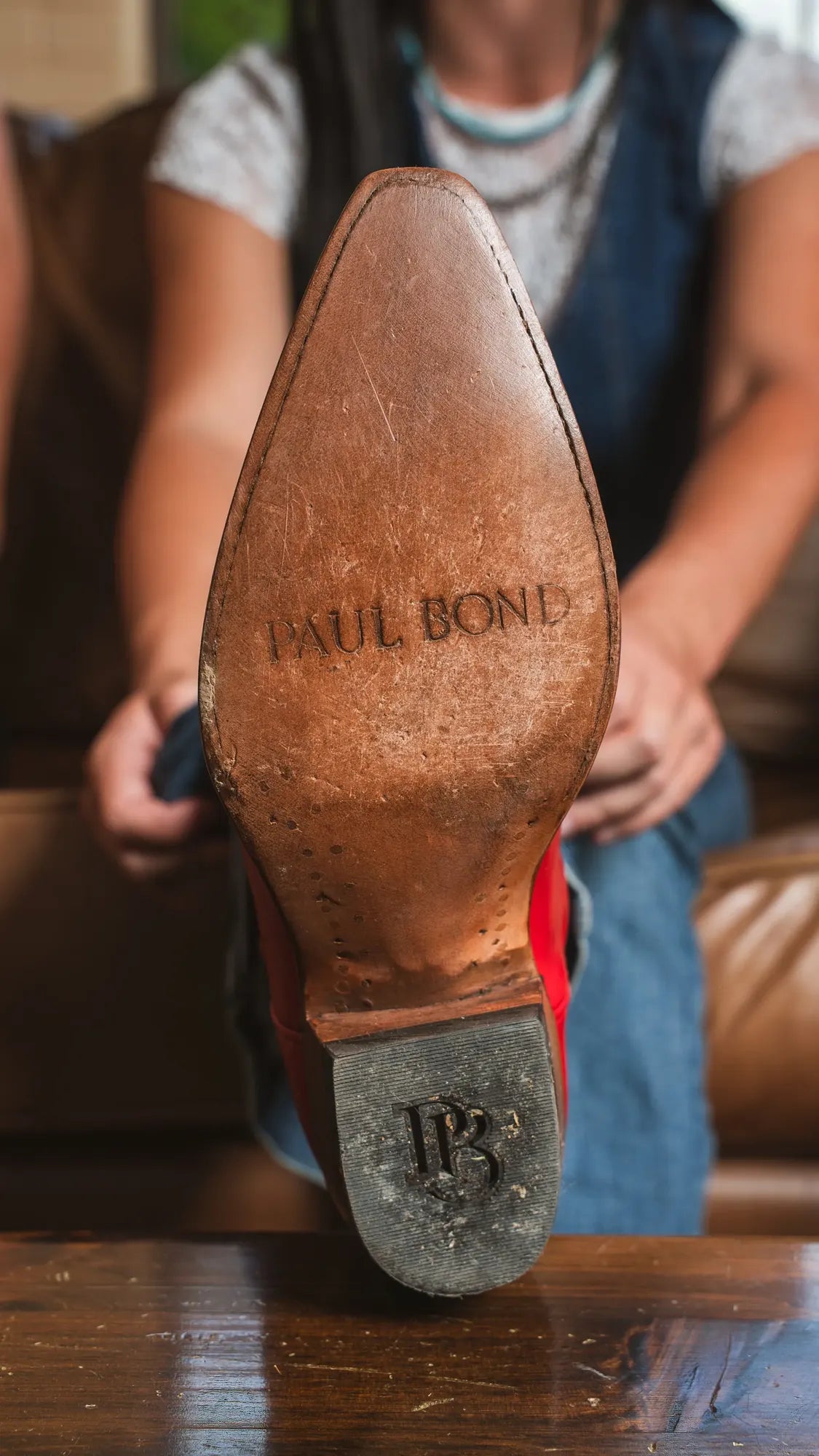 The leather sole of a Paul Bond boot, stamped with the Paul Bond name and heel mark