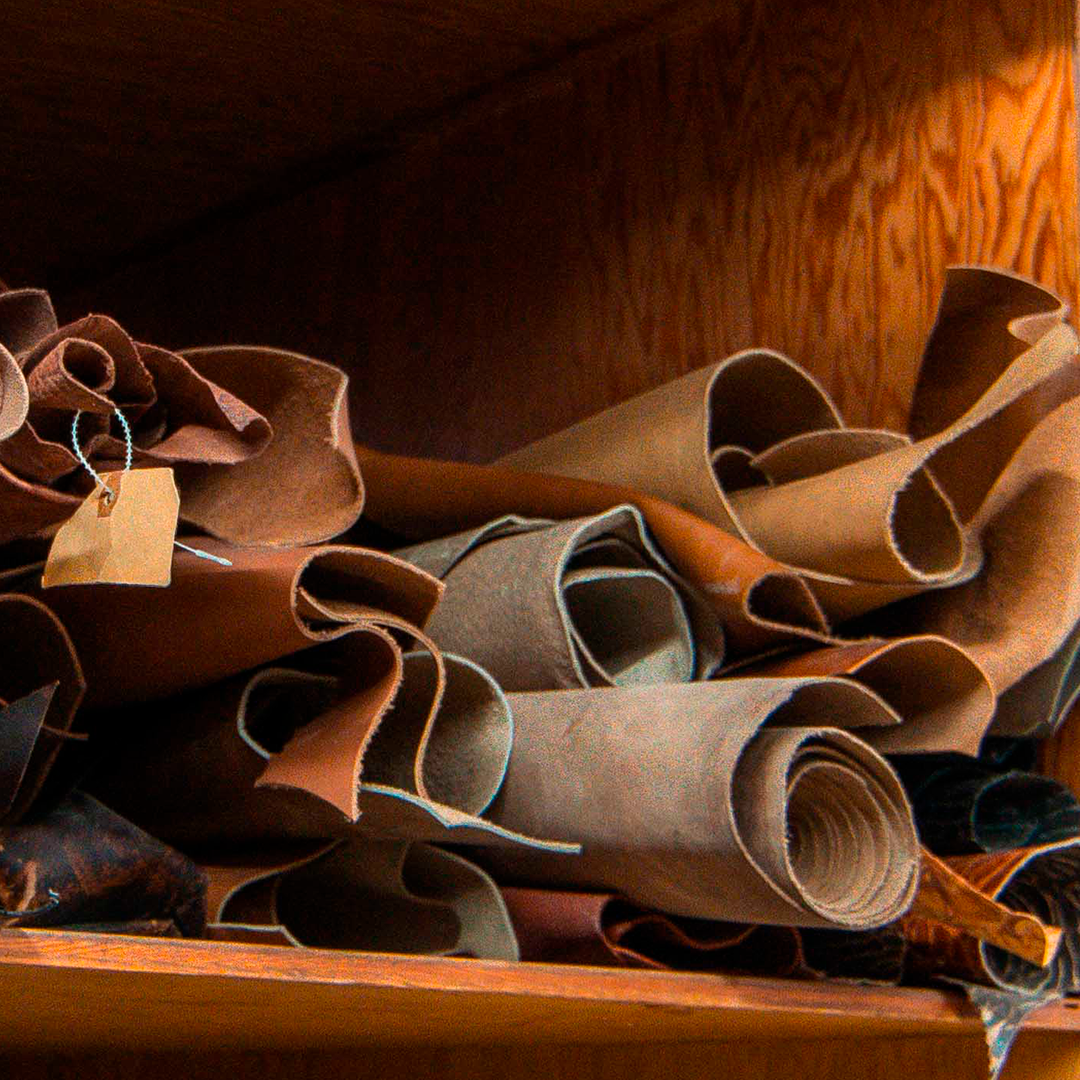 Rolls of raw leather in the workshop